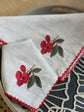 Natural linen cocktail napkins with embroidered cherries.