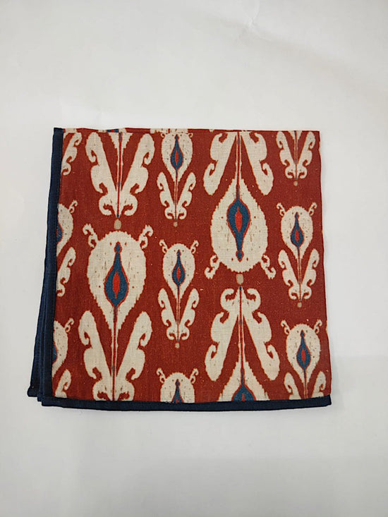 Maroon batic print linen dinner napkins.