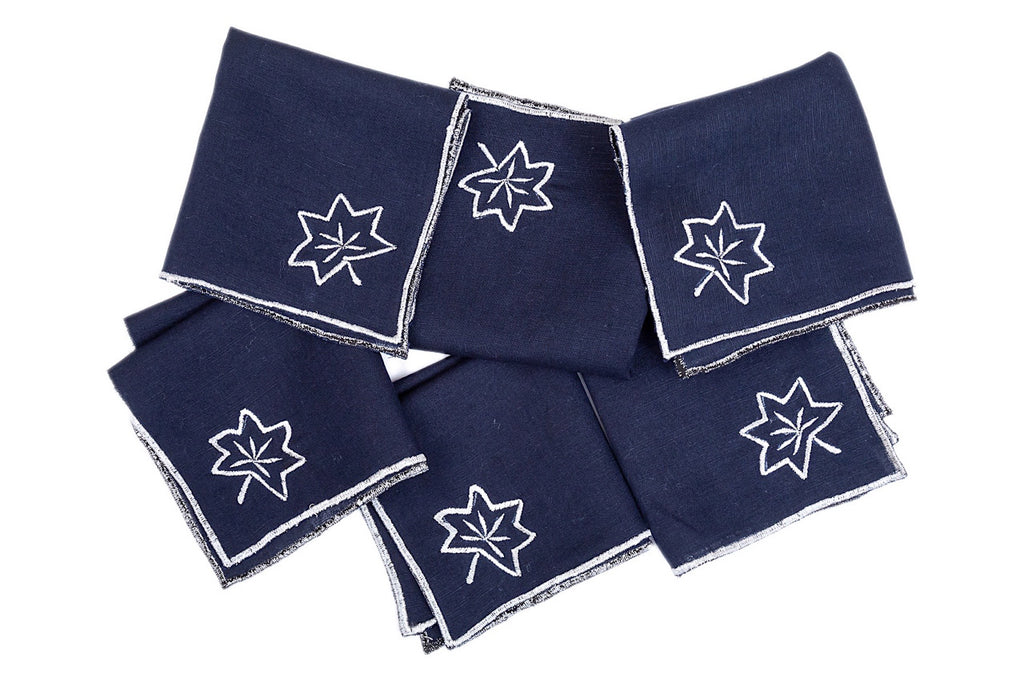 Navy blue  linen cocktail napkins with silver maple leaf embroidery.