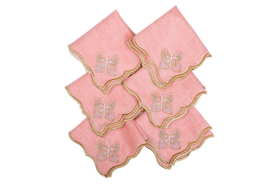 Peach linen cocktail napkins with butterfly embroidery.
