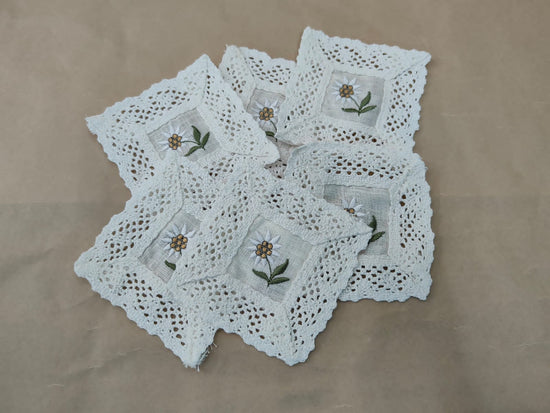 Off white linen crochet lace and embroidered coasters.