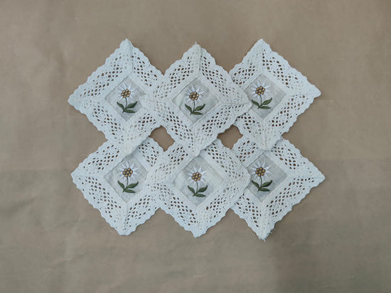 Off white linen crochet lace and embroidered coasters.