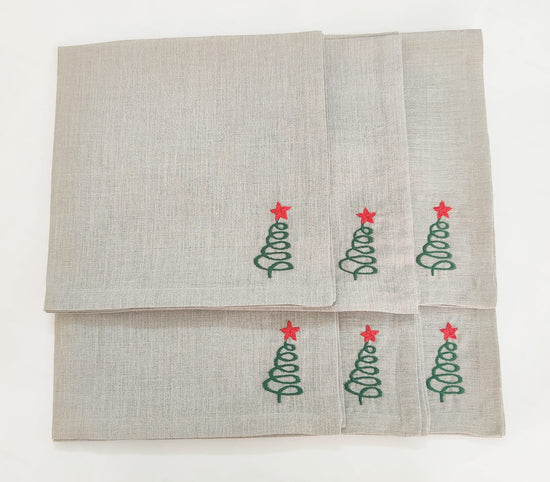 Linen christmas dinner napkins with embroidered christmas tree.