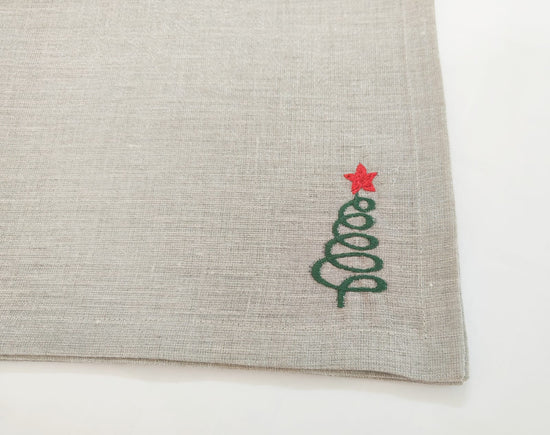 Linen christmas dinner napkins with embroidered christmas tree.