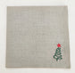 Linen christmas dinner napkins with embroidered christmas tree.