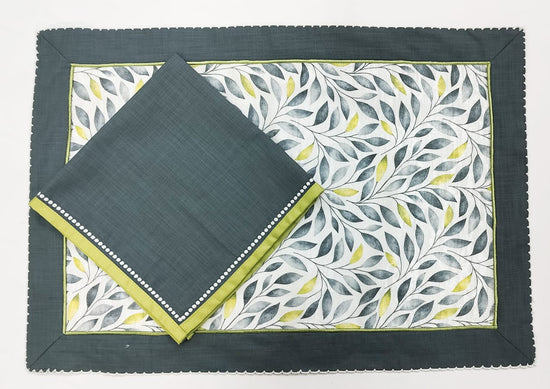 Leaves printed linen placemats with dark green linen napkins.