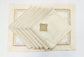 Cream printed placemats with cream embroidered linen napkins.