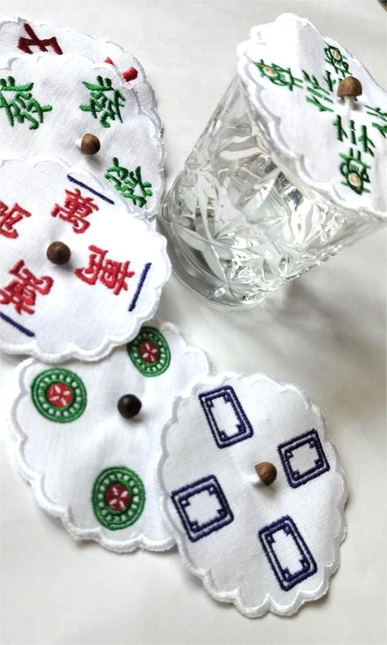 White linen  mahjong assorted glass covers.