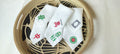 White linen  mahjong assorted cocktail napkins.
