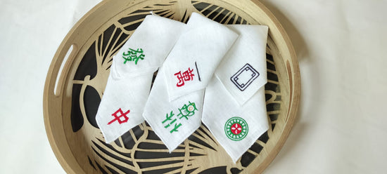 White linen  mahjong assorted cocktail napkins.