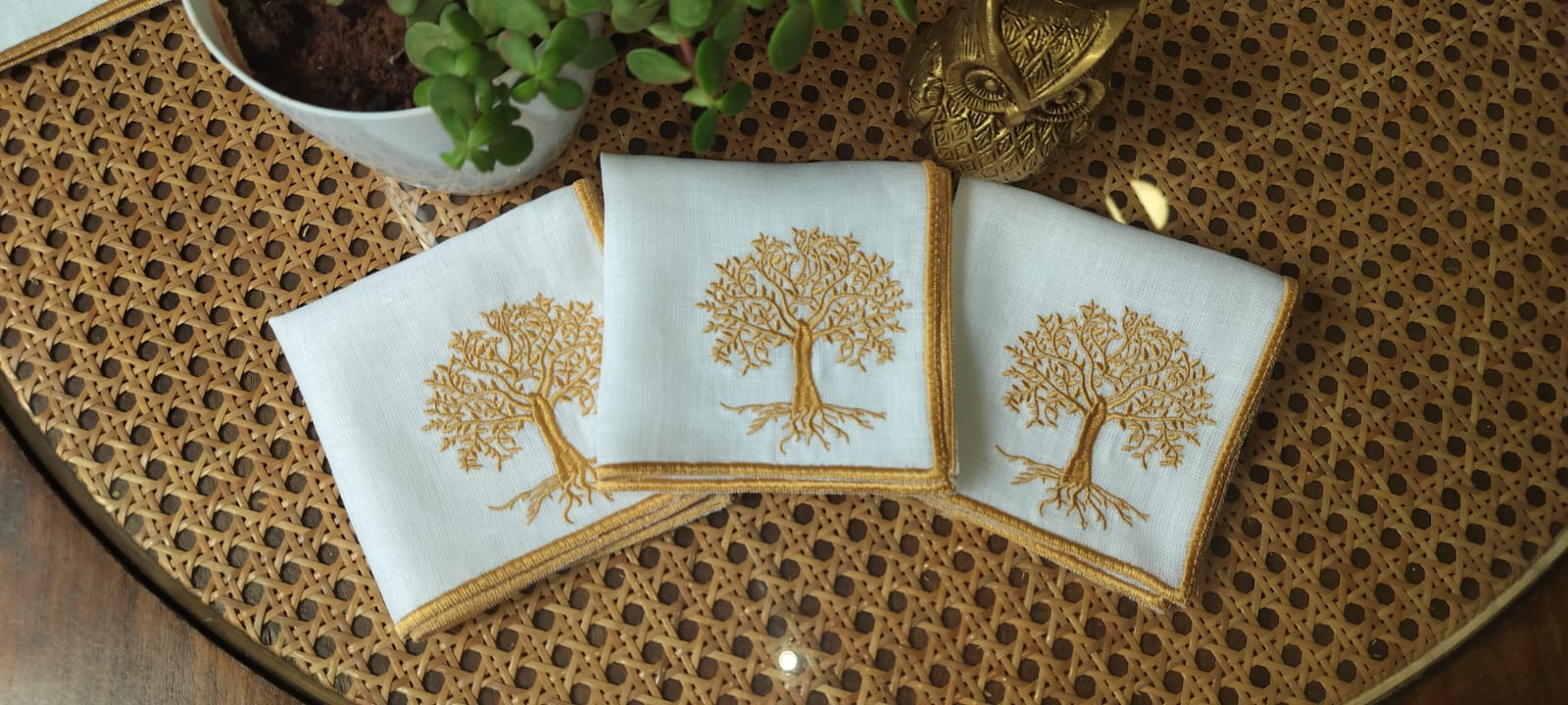 White linen cocktail napkins with tree embroidery