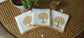 White linen cocktail napkins with tree embroidery