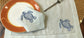 Powder blue linen placemats and napkins with embroidered turtle.