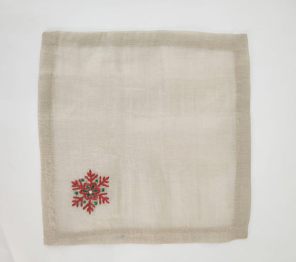 Linen christmas cocktail napkins with embroidered snowflake.