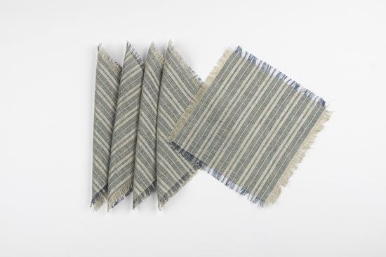 Frayed blue, off white and silver striped linen cocktail napkins.