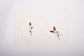 White linen placemats  and napkins with rosebud embroidery.