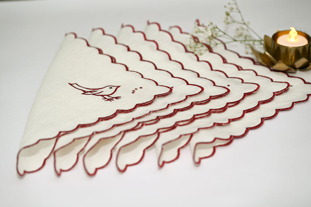 White linen cocktail napkin with bird embroidery
