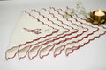 White linen cocktail napkin with bird embroidery