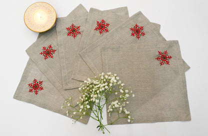 Linen christmas cocktail napkins with embroidered snowflake.