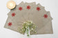 Linen christmas cocktail napkins with embroidered snowflake.