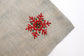 Linen christmas cocktail napkins with embroidered snowflake.