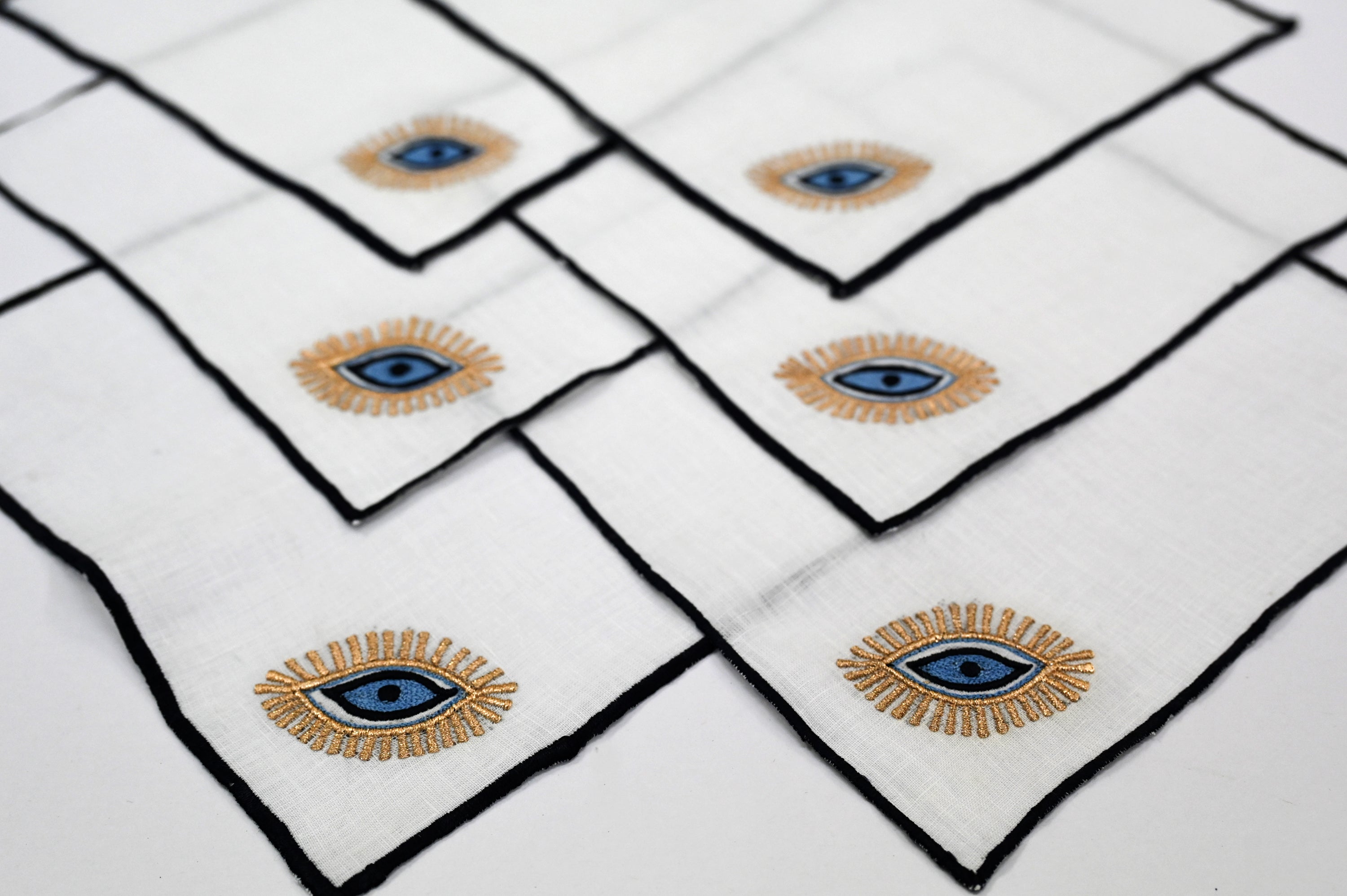 Evil eye white linen cocktail napkin