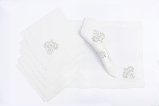 White linen placemats & napkins with silver motifs