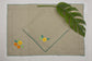 Natural Linen With Yellow And Orange Floral Placemats And Napkins