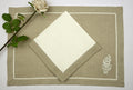 White Linen Napkins With Natural Flange And Natural Mats With White Floral Embroidery