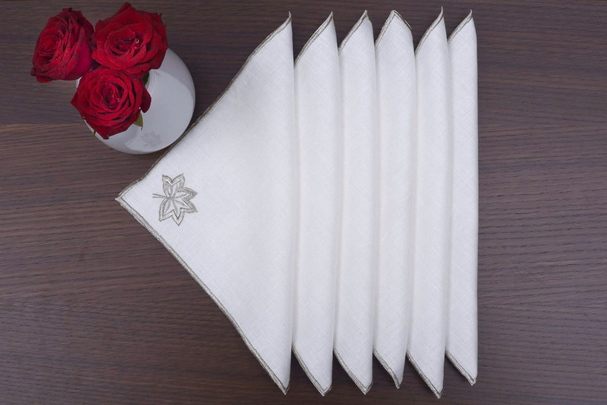 White Linen cocktail napkins with silver maple leaf embroidery