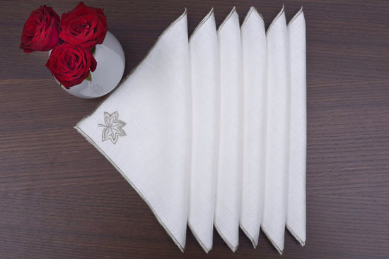 White Linen cocktail napkins with silver maple leaf embroidery