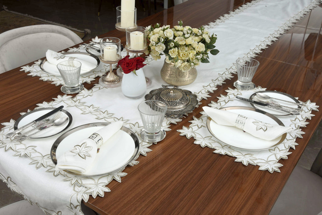 White linen runner with gold cutwork embroidery