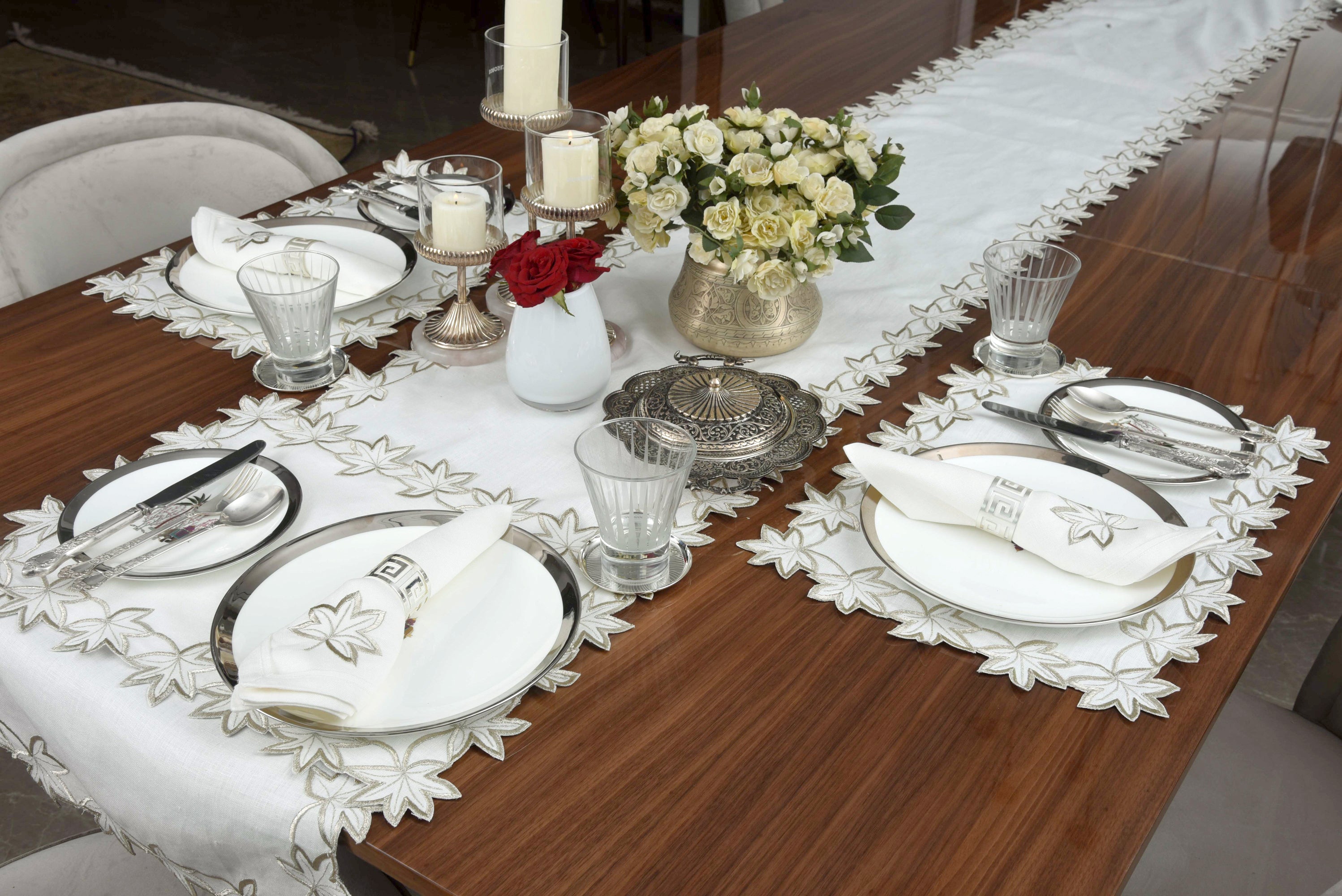 White linen runner with gold cutwork embroidery