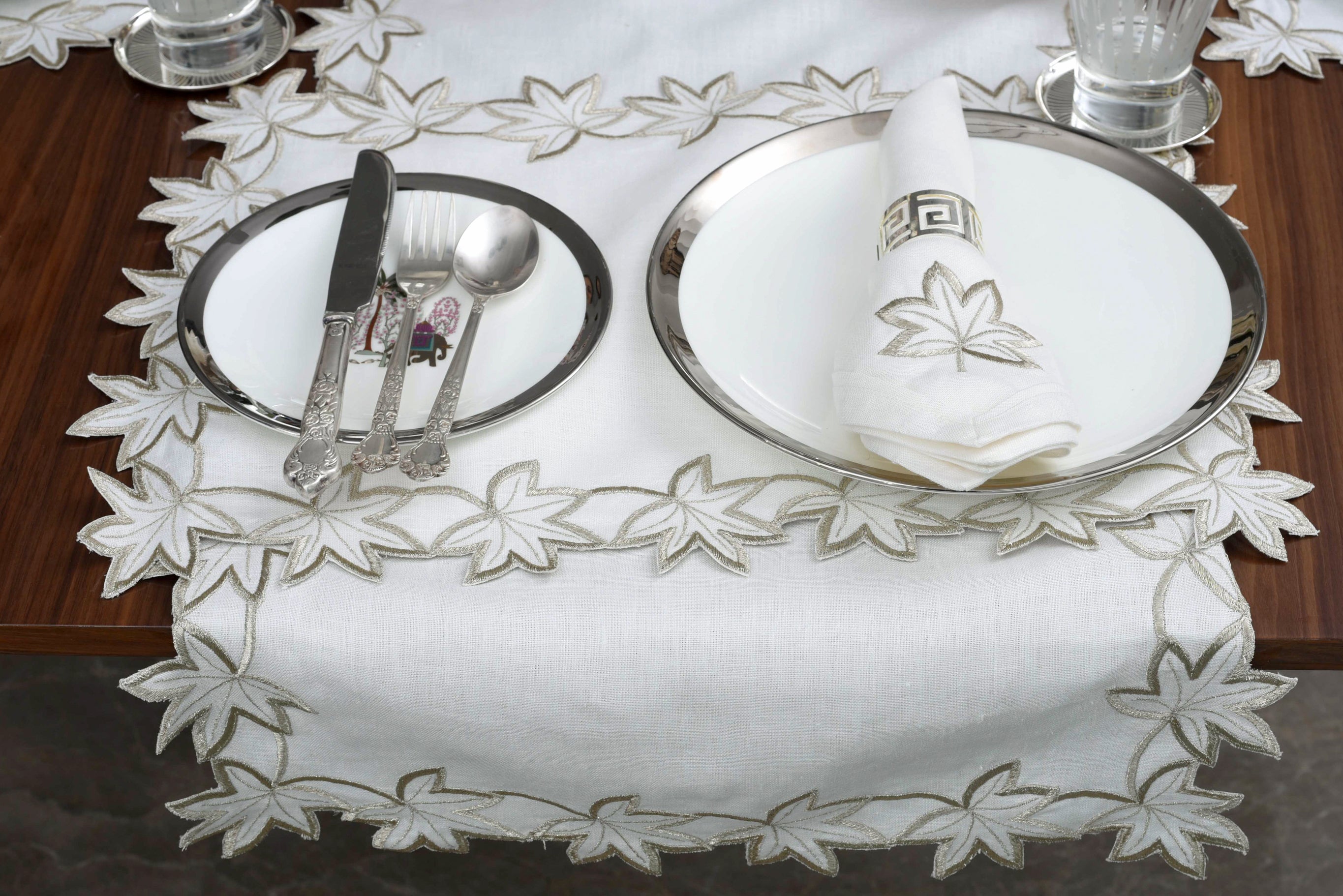 White linen runner with gold cutwork embroidery