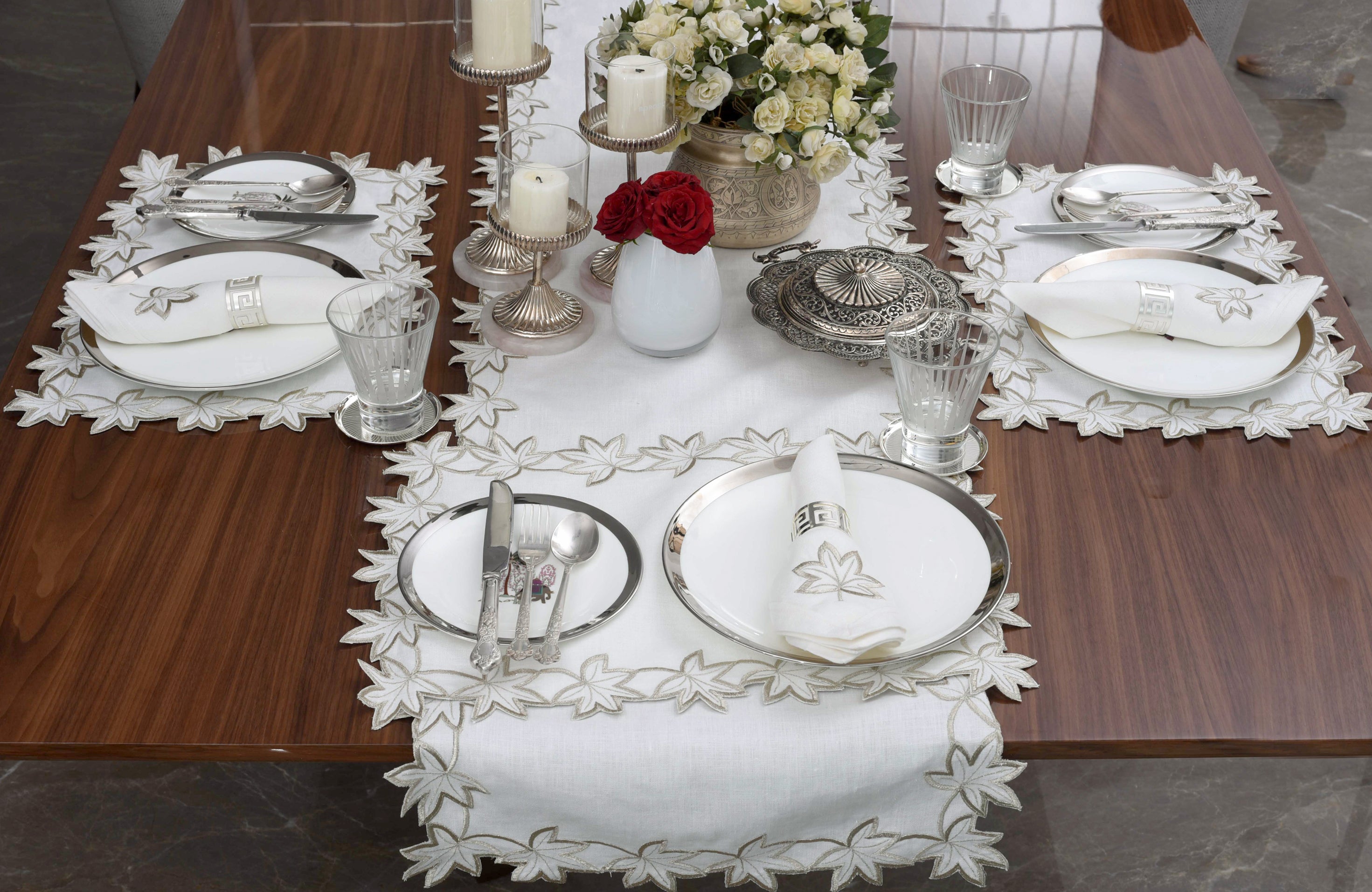 White linen runner with gold cutwork embroidery