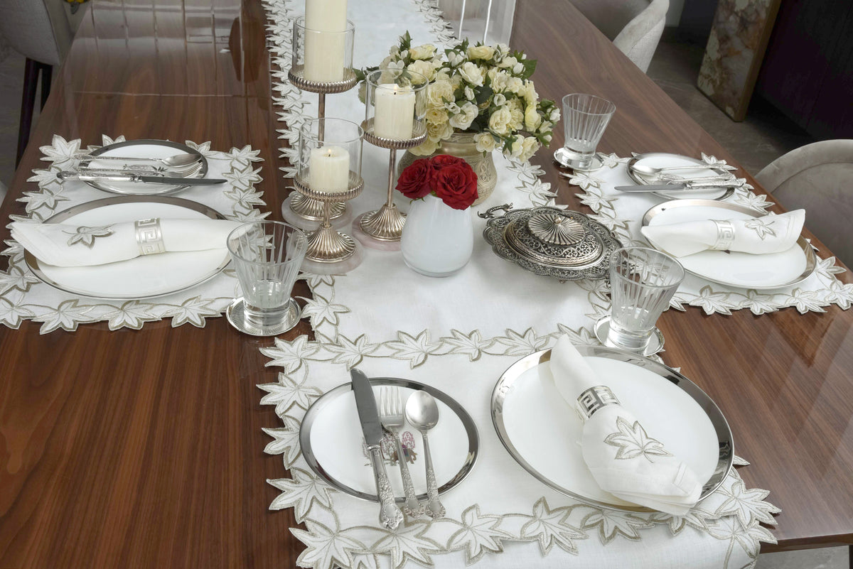 White linen runner with silver cutwork embroidery